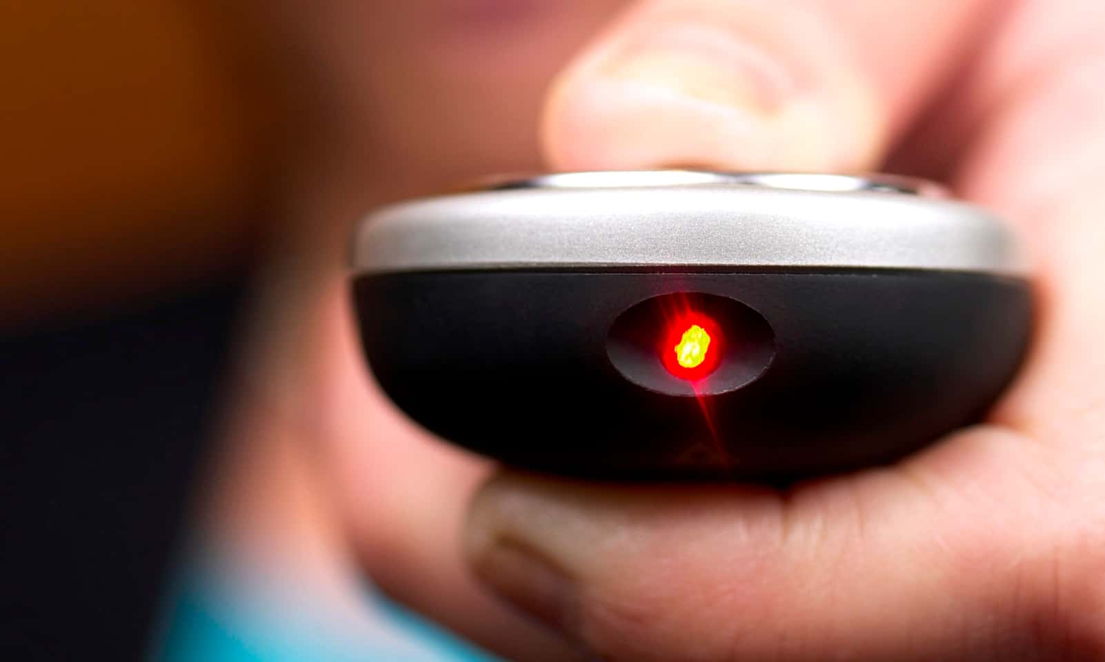 Hand using a remote control