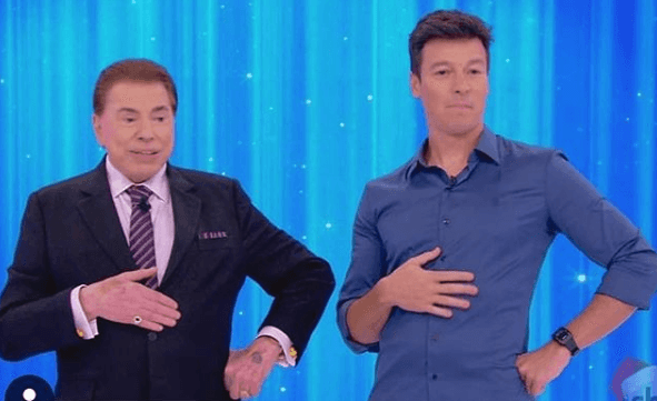 Os apresentadores Silvio Santos e Rodrigo Faro. (Foto: Reprodução)