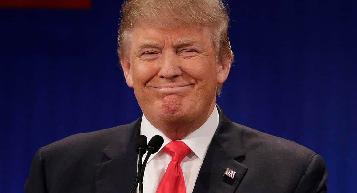 Republican presidential candidate, businessman Donald Trump stands during the Fox Business Network Republican presidential debate at the North Charleston Coliseum, Thursday, Jan. 14, 2016, in North Charleston, S.C. (AP Photo/Chuck Burton)