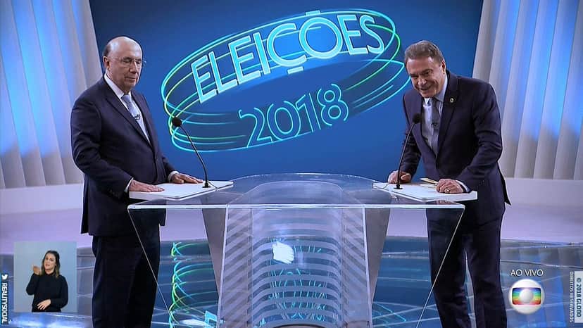 Henrique Meirelles e Álvaro Dias no centro do debate na Globo com a mediação de William Bonner (Foto: Reprodução/Globo) Henrique Meirelles e Álvaro Dias no centro do debate na Globo com a mediação de William Bonner (Foto: Reprodução/Globo)