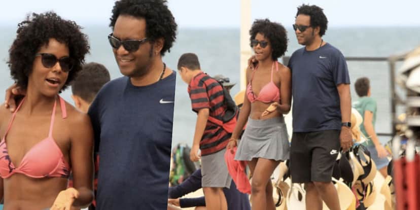 Maju Coutinho foi flagrada por paparazzis na praia ao lado do marido (Foto: reprodução) Maju Coutinho foi flagrada por paparazzis na praia ao lado do marido (Foto: reprodução)