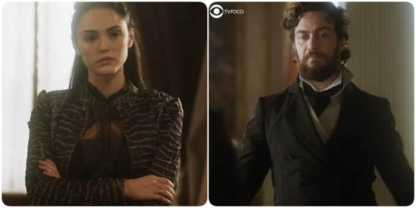 Foto montagem da novela de época Novo Mundo onde Anna, mulher branca de vestido escuro, está de braços cruzados e Thomas, homem branco e de barba castanha, está olhando para baixo com trajes de época Foto montagem da novela de época Novo Mundo onde Anna, mulher branca de vestido escuro, está de braços cruzados e Thomas, homem branco e de barba castanha, está olhando para baixo com trajes de época
