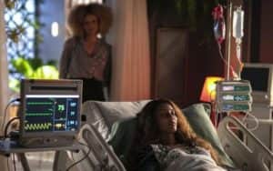 Mesmo em coma, Clarice (Taís Araujo) terá de enfrentar um problemão com Leonardo (Ìcaro Silva) em Cara e Coragem (Foto: Reprodução / Globo) Mesmo em coma, Clarice (Taís Araujo) terá de enfrentar um problemão com Leonardo (Ìcaro Silva) em Cara e Coragem (Foto: Reprodução / Globo)