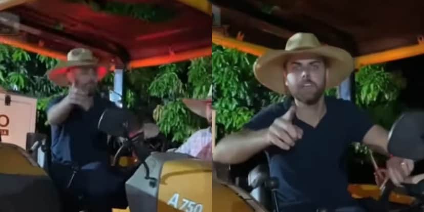 O cantor controlando um dos tratores para desatolar os caminhões (Reprodução: Youtube) O cantor controlando um dos tratores para desatolar os caminhões (Reprodução: Youtube)