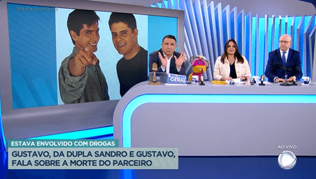 Reinaldo Gottino e Fabíola Reipert trouxeram à tona na "Hora da Venenosa" do "Balanço Geral" o caso chocante da dupla Sandro e Gustavo (Foto Reprodução/PlayPlus) Reinaldo Gottino e Fabíola Reipert trouxeram à tona na "Hora da Venenosa" do "Balanço Geral" o caso chocante da dupla Sandro e Gustavo (Foto Reprodução/PlayPlus)